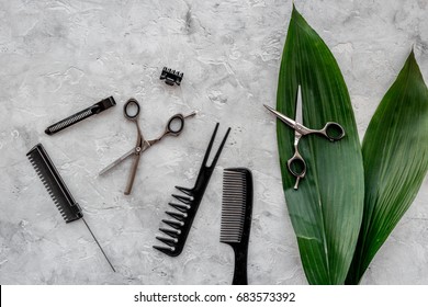 Beauty saloon. Haidressing tools on grey table background top view