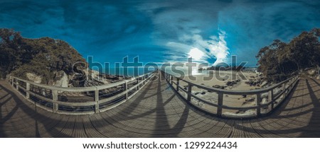 Similar – wooden platform with blue posts with ropes and orange lifebuoys on the background of the sea and sky with clouds Egypt Dahab South Sinai