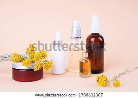 Beauty set made of natural organic cosmetic massage oil, cream, serum , hydrolate and herbs. Natural  luxury cosmetic consept.