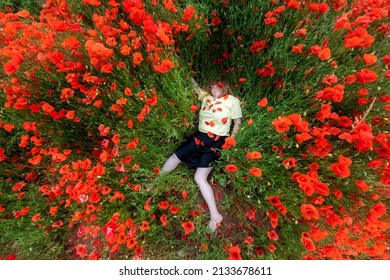 Beauty, Sexy, Mature Woman, Lying Dead In A Yellow Shirt In A Field Of Red Poppy Flowers, Copy Space