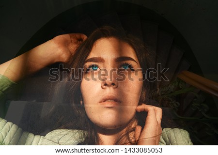 Similar – Artistic portrait of a brunette woman with a light effect