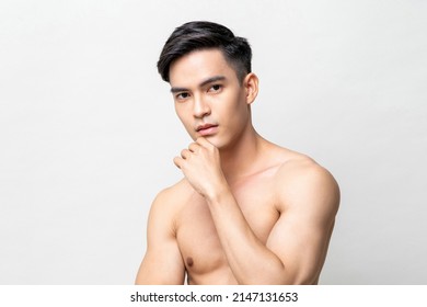 Beauty Short Of Handsome Muscular Shirtless Asian Man On Gray Isolated Background In Light Studio