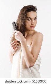 Beauty Shot Of A Young Girl With A White Bathrobe Brushing Her Long Wet Hair