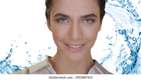 Beauty Shot Of Young Woman With Perfect Face Skin Just Cleaned From Impurities Ready For Moisturizing Cream Is Smiling In Camera On Splash Water Background. Concept Of Skincare, Cosmetics, Healthcare