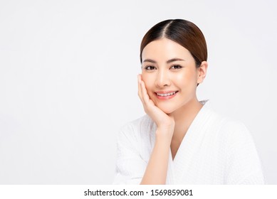 Beauty Shot Of Youthful Bright Skin Pretty Asian Woman With Hand Touching Face On White Background