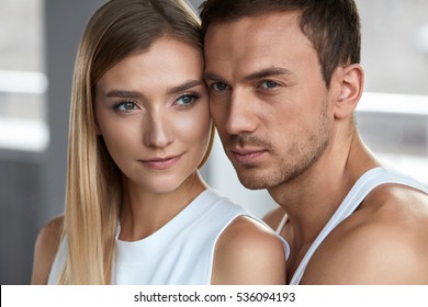 Beauty And Skin Care. Beautiful Couple In Love Closeup. Portrait Of Romantic Loving People, Happy Handsome Man And Smiling Woman With Fresh Soft Skin, Natural Face Makeup. Cosmetics. High Resolution