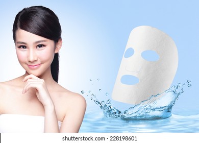 Beauty Skin Care Concept, Beautiful Woman Face With Water Splashes And Cloth Facial Mask Isolated On Blue Background, Asia