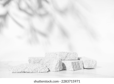 Beauty skin care product presentation podium and display with copy space made with porous stones on white sunny background. Studio photography. - Shutterstock ID 2283715971