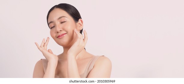 Beauty and skin concept. Young asian woman beauty face make up for skincare cosmetic and showing natural wellness soft and firm and ageless facial skin. younger looking youthful. real acne no retouch.