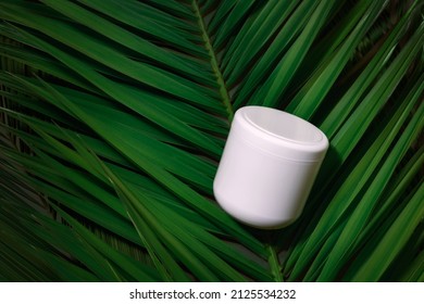 Beauty Skincare Cosmetic, Hair Conditioner Mockup Cream Lotion White Bottle Pakage On Tropical Palm Leaves Background.  