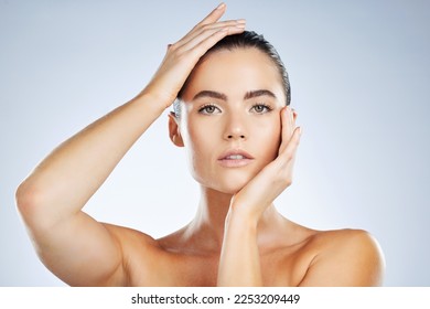 Beauty, skincare cosmetics and portrait of a woman isolated on a grey studio background. Glow, clean and face of a spa dermatology model with facial health, hydration and wellness on a backdrop