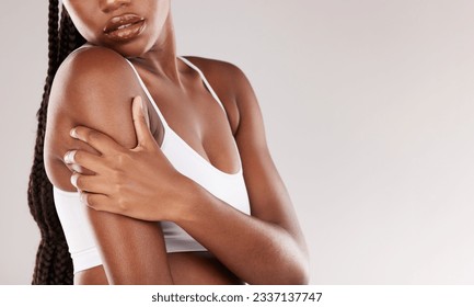 Beauty, skincare and health with shoulder of black woman in studio for wellness, spa treatment or self care. Cosmetics, dermatology and glow with closeup of model on white background for mockup space - Powered by Shutterstock