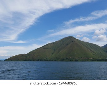 The beauty of the sky, hills and lake that stretch over the breadth of lake toba