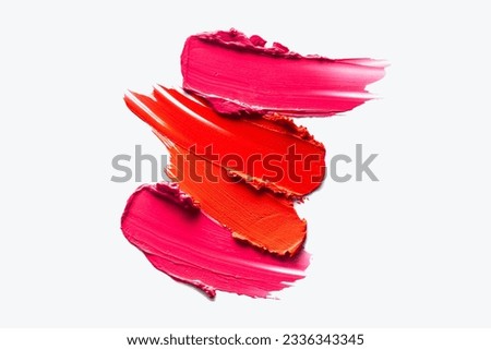 Beauty texture smudge lipstick multi colored scarlet red, fuchsia and pink smudge isolated on gray