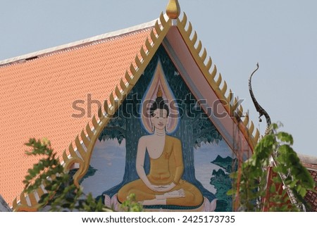 The beauty of Thai temple roofs The intricate details of traditional Thai temple roofs contrast with the bright blue sky. Thai culture art