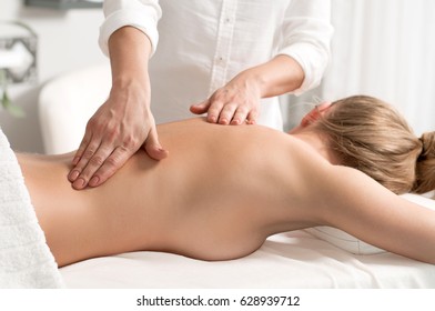 Beauty treatment concept. Beautiful woman having massage at spa salon