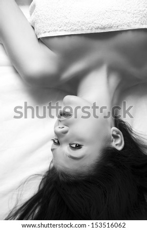 Similar – a girl with her hair by her face lying on the bed