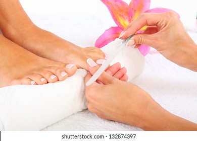 Beauty treatment photo of nice pedicured feet