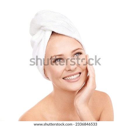 Beauty unmeasurable. Studio shot of a young woman with her head wrapped in a towel isolated on whiteBeauty u.