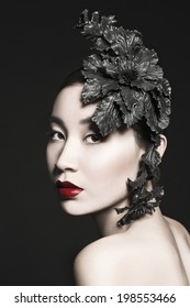 Beauty Vogue Style Fashion Chinese Model Girl with Red lips and Big Dark Flower like Hat on her Head