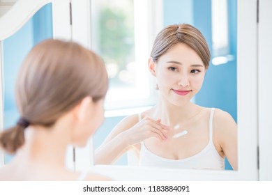 Beauty Woman Apply Cream With Neck At Home