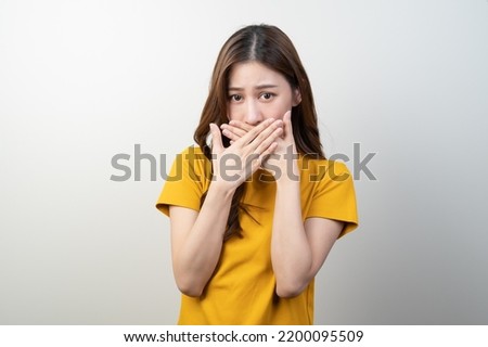beauty woman checking oral smell isolated on background