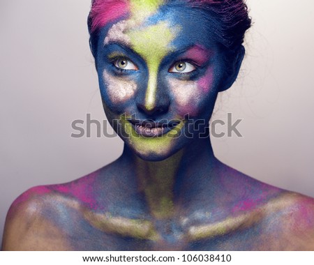 beauty woman with creative make up like Holy celebration in India