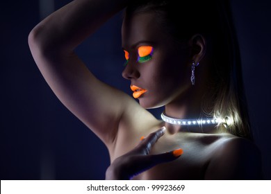 Beauty woman dance with glow make-up