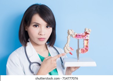 Beauty Woman Doctor With Colorectal Cancer Concept On The Blue Background