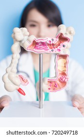 Beauty Woman Doctor With Colorectal Cancer Concept On The Blue Background