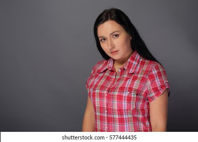 Beauty Woman Dressed In Shirt With Short Sleeves On Gray Background