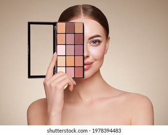 Beauty Woman With Eye Shadow Makeup Palette. Model With Healthy Perfect Skin, Close Up Portrait. Cosmetology, Beauty And Spa