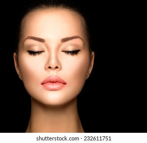 Beauty woman face closeup isolated on black background. Beautiful model girl makeup.  Gorgeous lady with closed eyes. perfect skin
