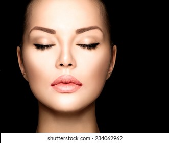 Beauty woman face closeup isolated on black background. Beautiful model girl makeup. Gorgeous lady with closed eyes. Perfect skin and make up