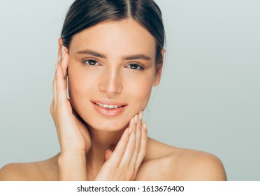 Beauty woman face healthy skin natural makeup hand touching face female model - Shutterstock ID 1613676400