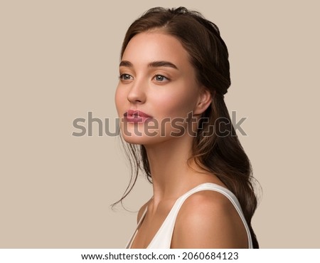 Beauty woman face healthy skin care female beautiful woman. Color brown background.