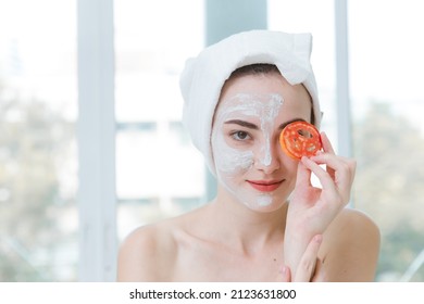 Beauty Woman Face Mask Skin Care With Tomato Vitamin Treatment In Spa Concept