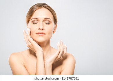 Beauty Woman face Portrait. Beautiful Spa model Girl with Perfect Fresh Clean Skin. Blonde female with closing eyes. Youth and Skin Care Concept - Shutterstock ID 1141787381