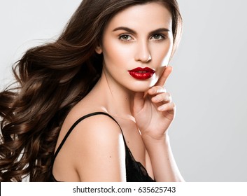 Beauty Woman face Portrait. Beautiful Spa model Girl with Perfect Fresh Clean Skin. Brunette female looking at camera and smiling on gray background. Beautiful hairstyle Youth and Skin Care Concept