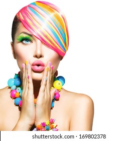 Beauty Woman Portrait with Colorful Makeup, Hair, Nail polish and Accessories. Colourful Studio Shot of Funny Model Girl. Vivid Colors. Manicure and Hairstyle. Rainbow Colors 