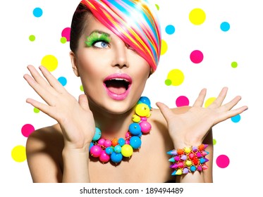Beauty Woman Portrait with Colorful Makeup, Hair, Nail polish and Accessories. Colourful Studio Shot of Girl Woman. Vivid Colors. Manicure and Hairstyle. Rainbow Colors. Open Mouth, Emotions 