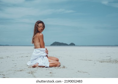 Beauty Woman Posing In The Beach Bikini, Cute, Fashion Model, Blonde Hair, Skin Tan, Wild Hair, White Dress, Kimono, Tattoo Hand And Body, Tanning, Skin Tan, Happy Face, Sea