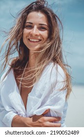 Beauty Woman Posing In The Beach Bikini, Cute, Fashion Model, Blonde Hair, Skin Tan, Wild Hair, White Dress, Kimono, Tattoo Hand And Body, Tanning, Skin Tan, Happy Face, Sea