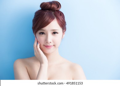 beauty woman smile to you isolated on bluebackground, asian