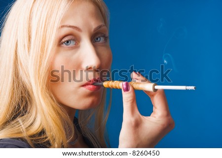 beauty woman smoking on blue background