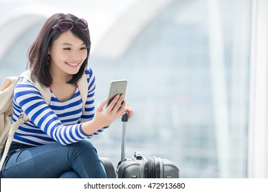 Beauty Woman Take Smart Phone And Smile In Airport, Asian