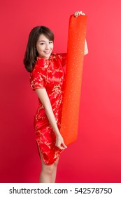beauty woman wear cheongsam and show couplets with chinese new year