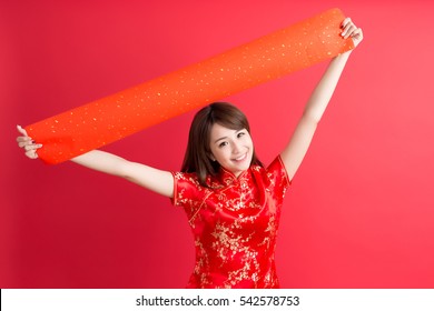 beauty woman wear cheongsam and show couplets with chinese new year