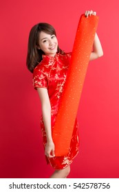 beauty woman wear cheongsam and show couplets with chinese new year