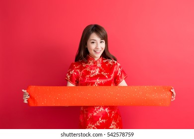beauty woman wear cheongsam and show couplets with chinese new year